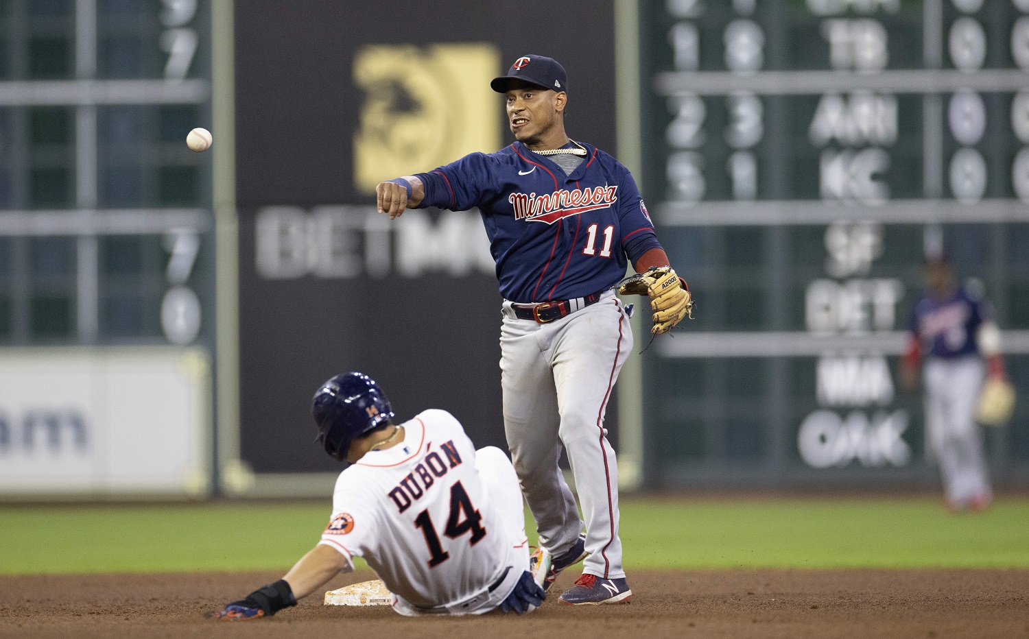 Minnesota Twins' Edouard Julien (47) talks to Carlos Correa